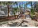 The backyard features a large patio area and mature trees providing shade and privacy at 1011 Indian Oaks W, Daytona Beach, FL 32117
