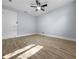 Neutral bedroom features wood-look flooring, and a ceiling fan at 1011 Indian Oaks W, Daytona Beach, FL 32117