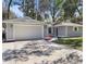 Charming one-story home featuring an attached two-car garage and a well-maintained front yard at 1011 Indian Oaks W, Daytona Beach, FL 32117