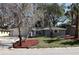 Charming single-story home with a well-maintained lawn, mature trees, and an attached garage at 1011 Indian Oaks W, Daytona Beach, FL 32117