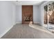 Living area featuring wood-look flooring, a brick fireplace, and sliding glass doors to the backyard at 1011 Indian Oaks W, Daytona Beach, FL 32117