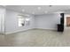 Bright and open living space featuring stylish flooring, ample natural light, and contemporary design at 1011 Indian Oaks W, Daytona Beach, FL 32117