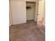 Bedroom features a closet with sliding doors and soft carpet at 10891 Sw 86Th Ave, Ocala, FL 34481