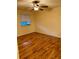 Cozy bedroom with a ceiling fan and window for natural light at 10891 Sw 86Th Ave, Ocala, FL 34481