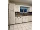Well-lit kitchen with white cabinets and stainless steel sink at 10891 Sw 86Th Ave, Ocala, FL 34481