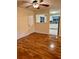 Bright living room featuring hardwood floors and a pass-through to the kitchen at 10891 Sw 86Th Ave, Ocala, FL 34481