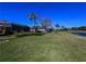 Expansive backyard featuring a golf course and serene pond, perfect for outdoor enjoyment and relaxation at 1317 Dovercourt Ln, Ormond Beach, FL 32174