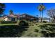 Nice screened enclosure with palm trees surrounding a manicured lawn in the backyard at 1317 Dovercourt Ln, Ormond Beach, FL 32174