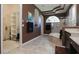 Elegant bathroom showcasing a walk-in closet, soaking tub and shower, and stylish design details at 1317 Dovercourt Ln, Ormond Beach, FL 32174