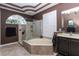 Beautiful bathroom with soaking tub, separate shower, and shuttered window providing natural light and privacy at 1317 Dovercourt Ln, Ormond Beach, FL 32174