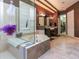 Modern bathroom featuring a glass-enclosed shower, soaking tub, and elegant design details and natural light at 1317 Dovercourt Ln, Ormond Beach, FL 32174