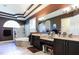 Well-lit bathroom featuring dual sinks, a soaking tub, separate shower, and a contemporary design at 1317 Dovercourt Ln, Ormond Beach, FL 32174