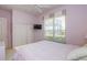 A light-purple bedroom featuring a closet and a window with blinds at 1317 Dovercourt Ln, Ormond Beach, FL 32174