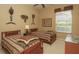 A bedroom with twin beds, a window with blinds, and wall decor at 1317 Dovercourt Ln, Ormond Beach, FL 32174