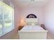 Bedroom showing a bed, a window with blinds, and a ceiling fan at 1317 Dovercourt Ln, Ormond Beach, FL 32174