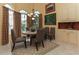 Dining room features a round table, patterned rug, and natural light at 1317 Dovercourt Ln, Ormond Beach, FL 32174