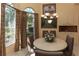 Dining room featuring round table, seating, and multiple windows at 1317 Dovercourt Ln, Ormond Beach, FL 32174