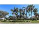 Elegant single-story home with meticulously maintained landscaping, mature palms and lush green lawn at 1317 Dovercourt Ln, Ormond Beach, FL 32174