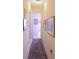 Hallway decorated with multiple pictures and tile flooring at 1317 Dovercourt Ln, Ormond Beach, FL 32174