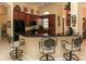 Kitchen with black granite countertops, dark wood cabinets, and bar seating at 1317 Dovercourt Ln, Ormond Beach, FL 32174