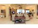 Inviting living room featuring neutral-colored walls, tiled floors, coffered ceilings, and an entertainment center at 1317 Dovercourt Ln, Ormond Beach, FL 32174