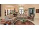 Spacious living room featuring neutral walls, tile flooring, and a view into the formal dining area at 1317 Dovercourt Ln, Ormond Beach, FL 32174
