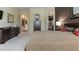 Well-appointed main bedroom with ensuite bathroom, ample closet space, and stylish modern furnishings at 1317 Dovercourt Ln, Ormond Beach, FL 32174