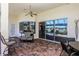 Inviting covered patio features brick flooring, ceiling fan, and seating with great views at 1317 Dovercourt Ln, Ormond Beach, FL 32174