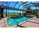 Gorgeous pool and spa with screened enclosure, surrounded by brick pavers and a tranquil setting at 1317 Dovercourt Ln, Ormond Beach, FL 32174