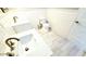 A crisp bathroom with subway tile walls, wood plank floors, and dual vanity sinks at 14 Sea Swallow Ter, Ormond Beach, FL 32176