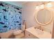 Beach-themed bathroom with a shark-patterned shower curtain at 14 Sea Swallow Ter, Ormond Beach, FL 32176