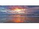 Beautiful beach sunrise with orange and purple clouds over the ocean water at 14 Sea Swallow Ter, Ormond Beach, FL 32176