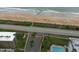 Aerial view showcasing beach access from nearby condominium and the ocean at 14 Sea Swallow Ter, Ormond Beach, FL 32176