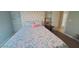 A cozy bedroom with a quilted headboard and charming decor at 14 Sea Swallow Ter, Ormond Beach, FL 32176