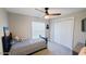Cozy bedroom featuring a striped bed, window, and closet at 14 Sea Swallow Ter, Ormond Beach, FL 32176