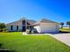 Charming single story home features a two-car garage and well-maintained lawn at 14 Sea Swallow Ter, Ormond Beach, FL 32176