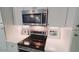 Close up on oven and microwave highlighting the stainless steel appliances at 14 Sea Swallow Ter, Ormond Beach, FL 32176