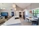 Open concept kitchen with a large island, stainless steel appliances, and a vaulted ceiling at 14 Sea Swallow Ter, Ormond Beach, FL 32176