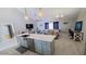 Open-concept kitchen with island seating, stainless steel appliances, and modern design at 14 Sea Swallow Ter, Ormond Beach, FL 32176