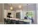 Modern kitchen with a center island, stainless steel appliances, and ample cabinet space at 14 Sea Swallow Ter, Ormond Beach, FL 32176