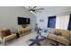 Comfortable living room with a large TV, stylish furnishings, and a relaxing atmosphere at 14 Sea Swallow Ter, Ormond Beach, FL 32176