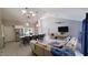 Spacious, open-concept living area with modern lighting and comfortable seating at 14 Sea Swallow Ter, Ormond Beach, FL 32176