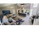 Open-concept living area with vaulted ceilings, adjacent kitchen, and stylish decor at 14 Sea Swallow Ter, Ormond Beach, FL 32176