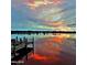 Scenic lakefront view at sunset reflecting colorful sky onto the water at 14 Sea Swallow Ter, Ormond Beach, FL 32176
