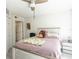 Comfortable bedroom featuring a ceiling fan, white walls, and a light wood-look bed frame at 1601 Big Tree Rd # 601, South Daytona, FL 32119