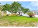 Expansive backyard features lush green grass, mature trees, and privacy fence at 168 Boynton Blvd, Daytona Beach, FL 32118