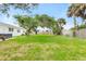 Large backyard featuring a large green lawn and partial fencing at 168 Boynton Blvd, Daytona Beach, FL 32118