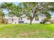 Large backyard featuring covered porch and hot tub at 168 Boynton Blvd, Daytona Beach, FL 32118