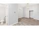 Comfortable bedroom with wood floors, neutral walls, contemporary light fixture, and a closet for ample storage at 168 Boynton Blvd, Daytona Beach, FL 32118