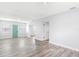 Bright living area featuring a light-filled atmosphere with clean walls, wood-look floors, and neutral decor at 168 Boynton Blvd, Daytona Beach, FL 32118